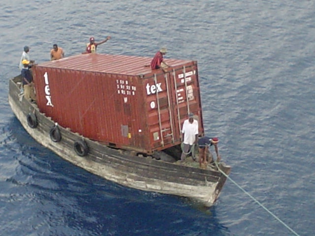 tiny boat big container
